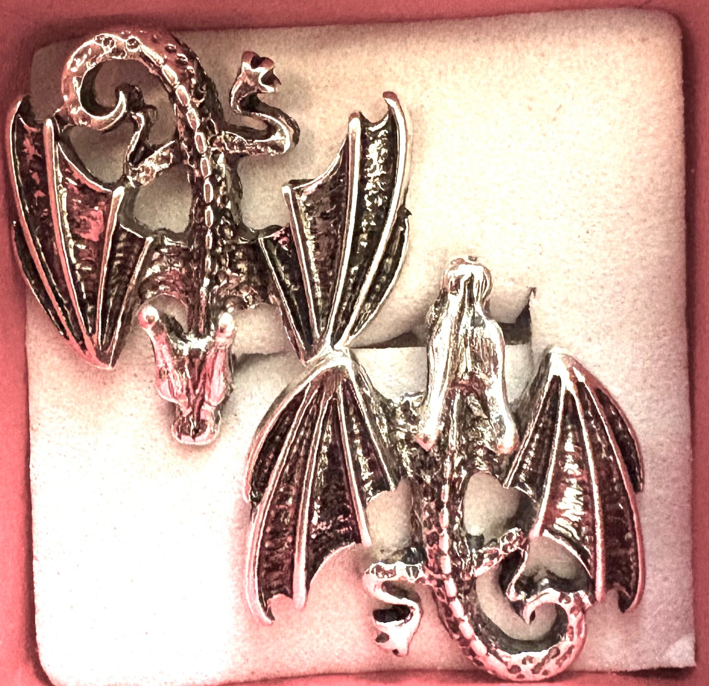 Dragon - flying dragon stud earrings silvery coloured.