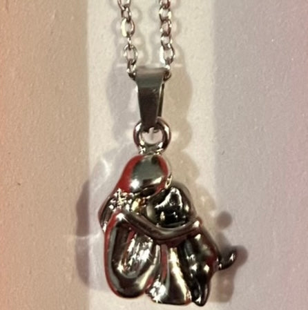 Necklace - Girl cuddling a black dog