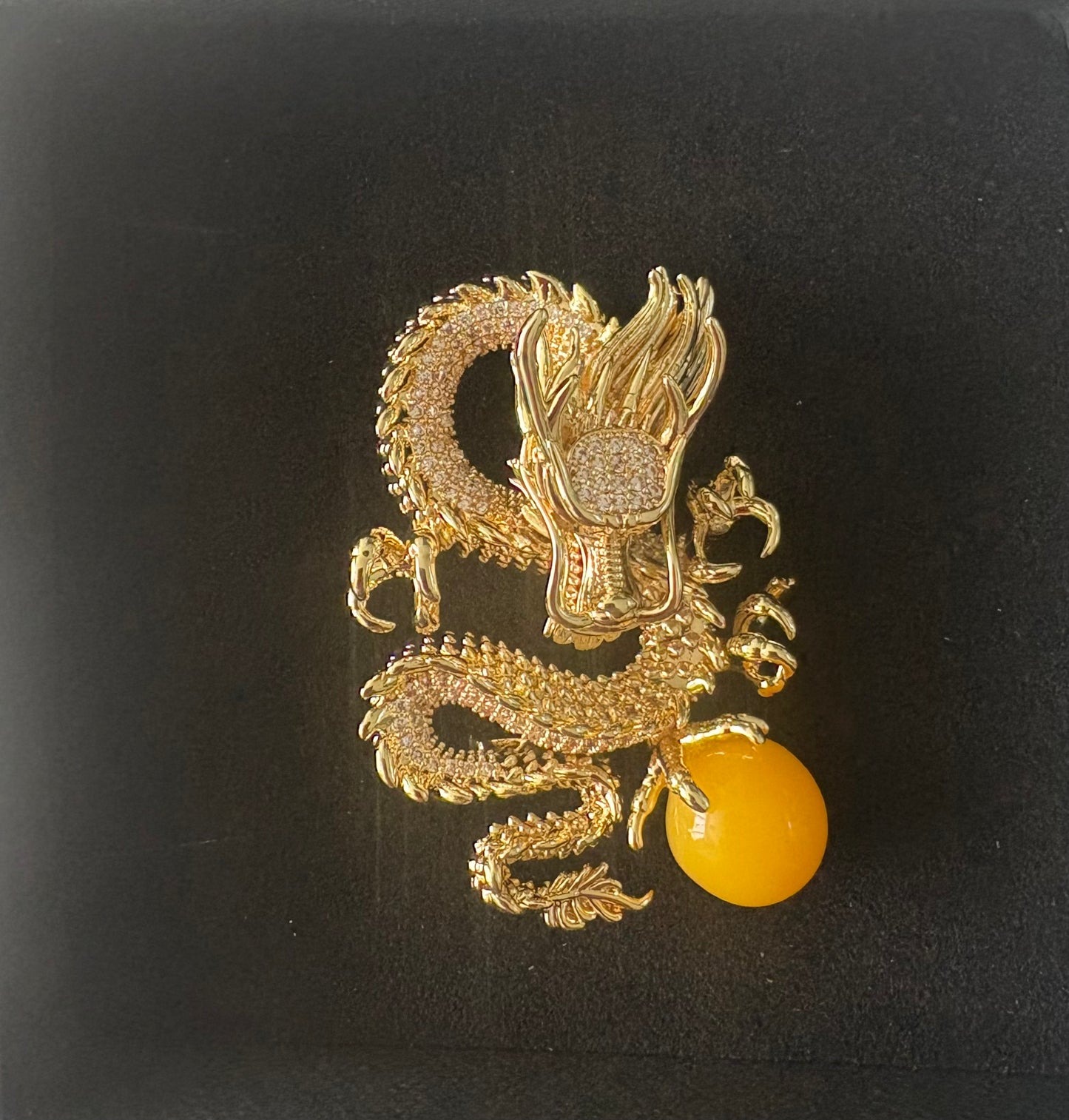 Dragon - dragon brooch, holding yellow ball. Gold coloured
