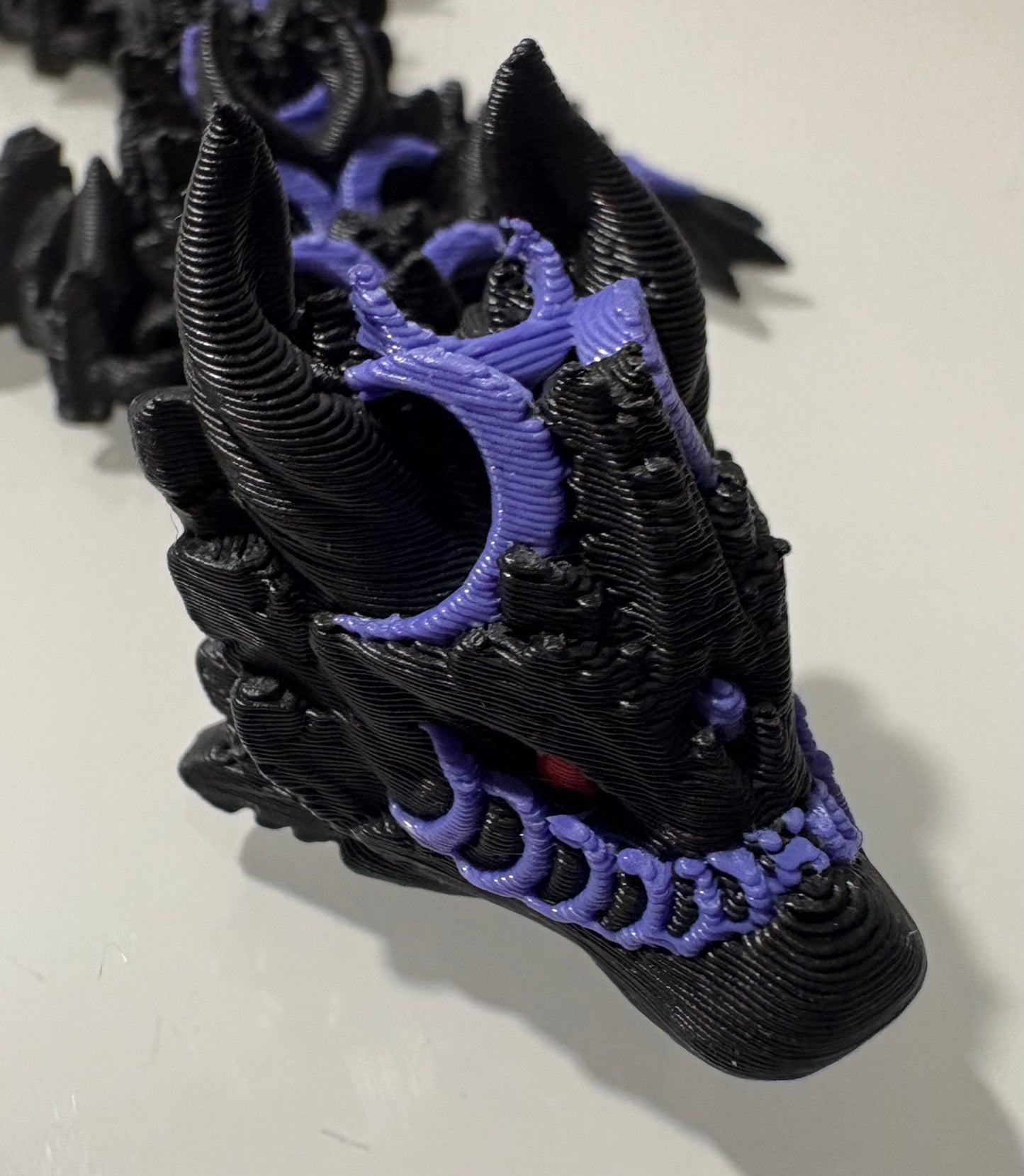 3D printed Dragon - black/ purple with red eyes.