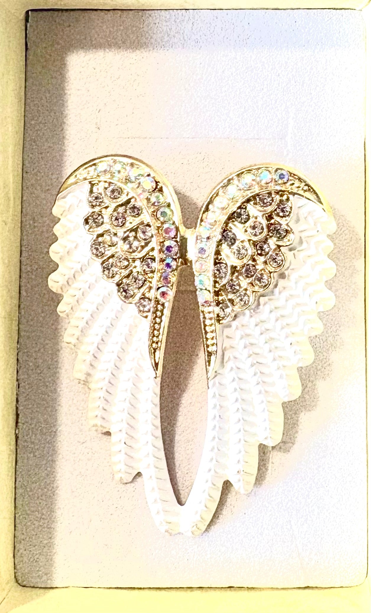 Angel wing brooch - gold coloured, white with crystal effect.