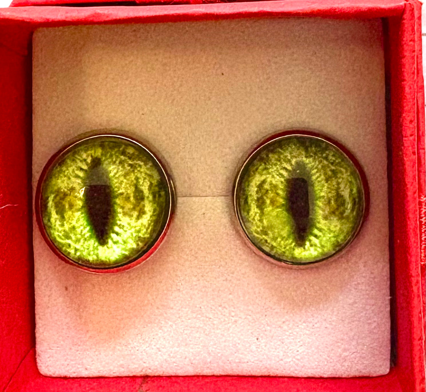 Dragon -  pair of stud earrings. dragon eye green